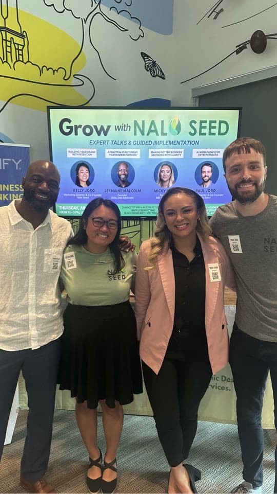 The four speakers, Jermaine Malcolm, Kelly Jorg, Micky Dawn and Paul Jorg, in front of the Grow with Nalo Seed screen